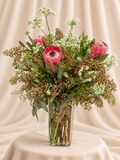 Protea + greenery arrangement