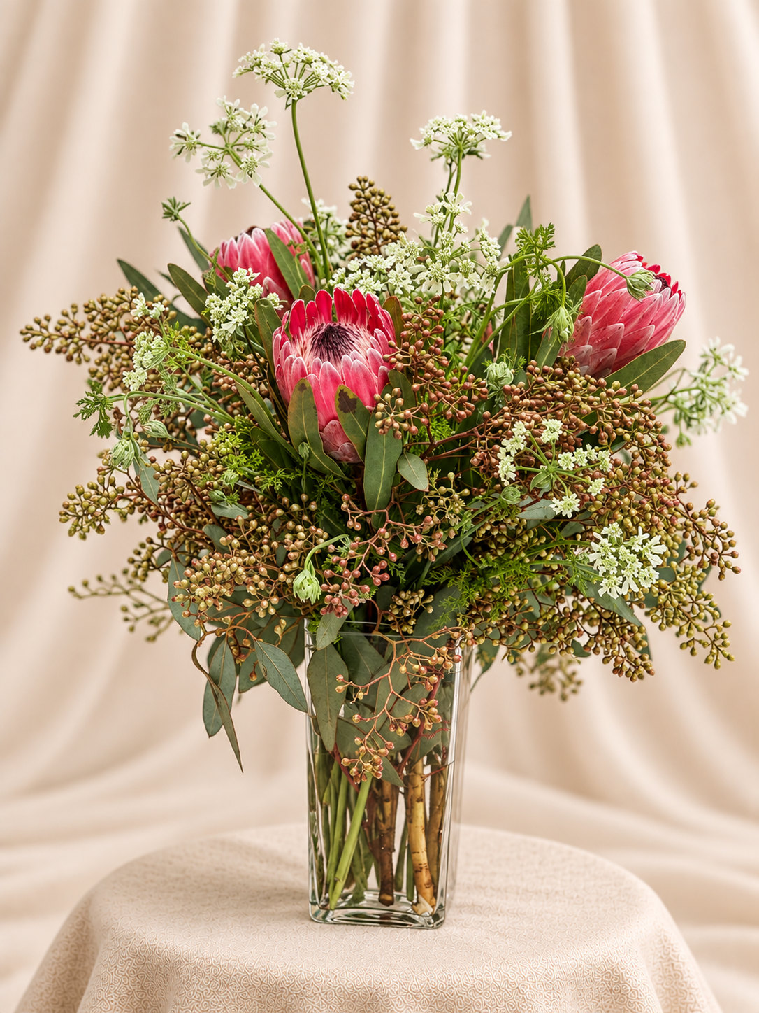 Protea + greenery arrangement